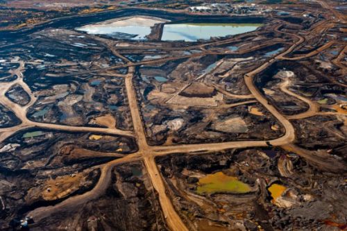Tar Sands’ hellish landscape of ruined Earth and toxic tailing ponds. Image source Occupy.